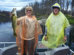 It looks like the rain didn't dampen either the spirits or the fishing on Eagle Lake that day. Brenda & Tom proudly show off their catch.